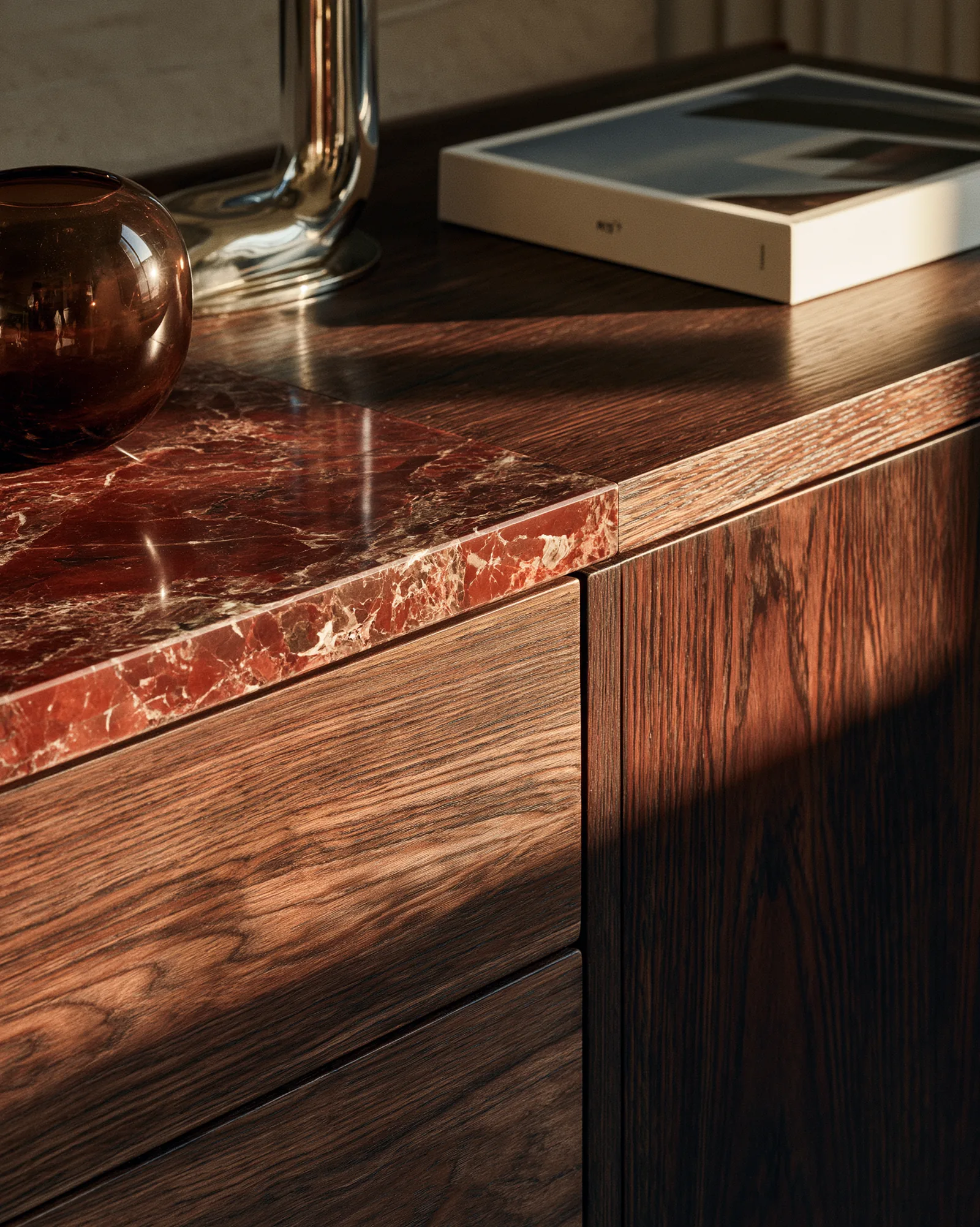 Red-veined marble set into walnut joinery