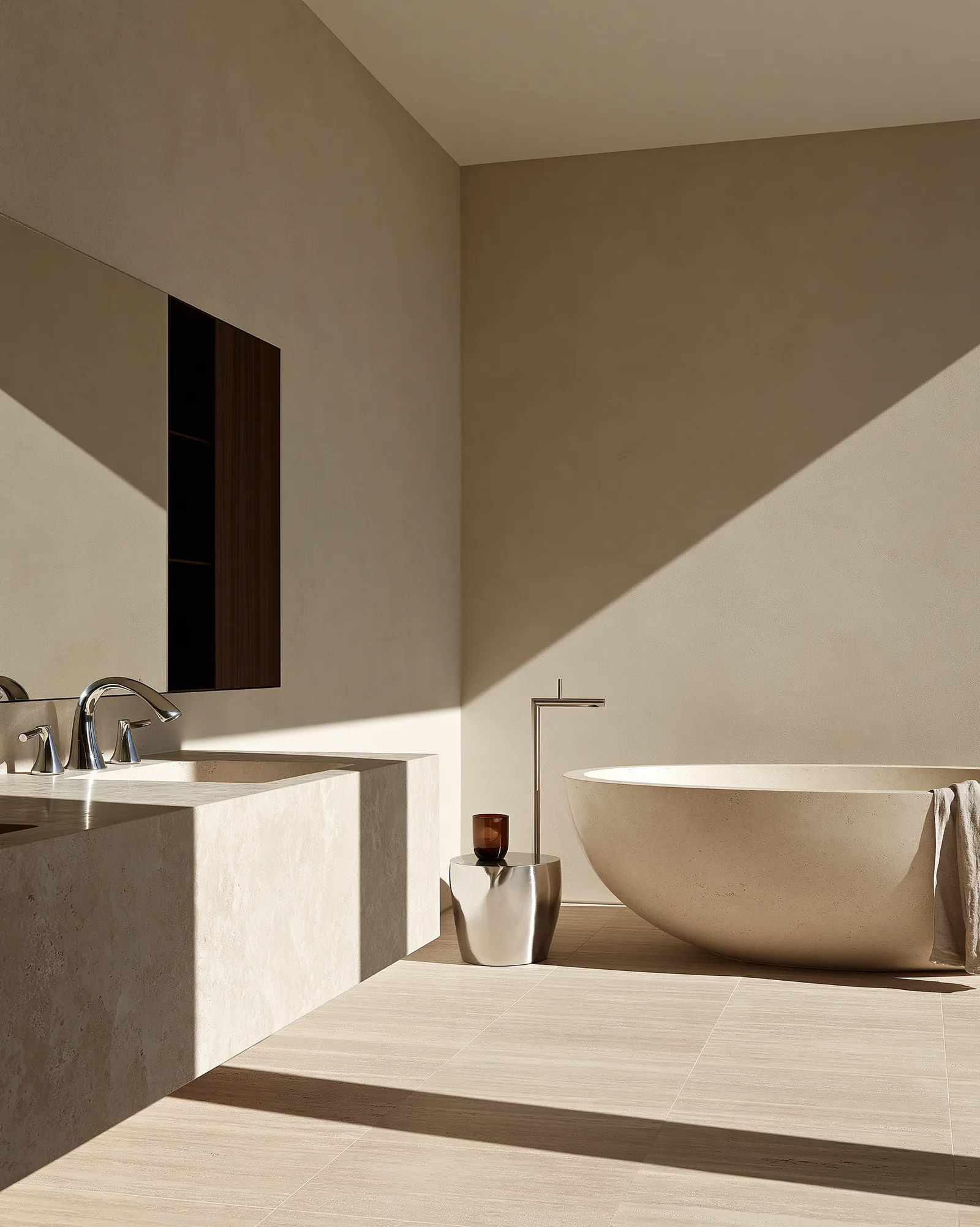 Freestanding stone bath and pale stone vanity at Son Vida House